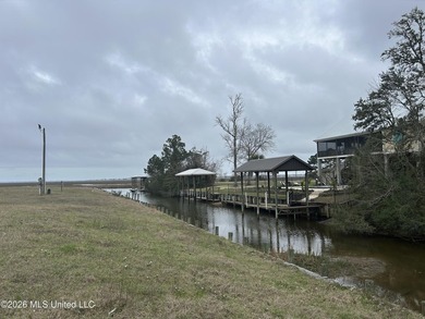 Beautiful waterfront lot offering stunning views and deep-water on Diamondhead Country Club in Mississippi - for sale on GolfHomes.com, golf home, golf lot