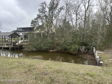 Beautiful waterfront lot offering stunning views and deep-water on Diamondhead Country Club in Mississippi - for sale on GolfHomes.com, golf home, golf lot