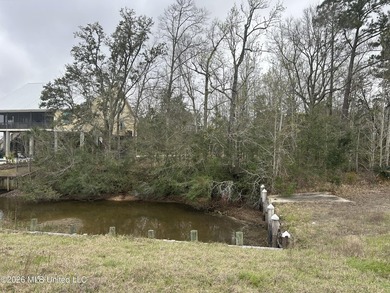 Beautiful waterfront lot offering stunning views and deep-water on Diamondhead Country Club in Mississippi - for sale on GolfHomes.com, golf home, golf lot