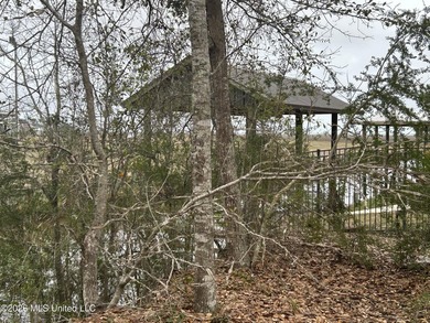 Beautiful waterfront lot offering stunning views and deep-water on Diamondhead Country Club in Mississippi - for sale on GolfHomes.com, golf home, golf lot
