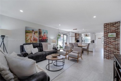 Experience luxury living in this stunning corner unit in Boca on Boca Lago Golf and Country Club in Florida - for sale on GolfHomes.com, golf home, golf lot