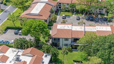 Experience luxury living in this stunning corner unit in Boca on Boca Lago Golf and Country Club in Florida - for sale on GolfHomes.com, golf home, golf lot