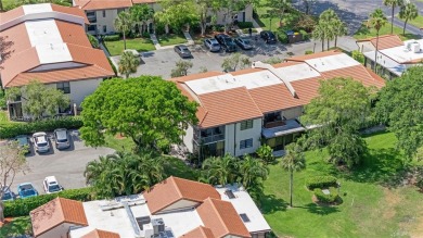 Experience luxury living in this stunning corner unit in Boca on Boca Lago Golf and Country Club in Florida - for sale on GolfHomes.com, golf home, golf lot