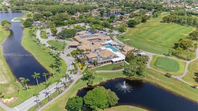 Experience luxury living in this stunning corner unit in Boca on Boca Lago Golf and Country Club in Florida - for sale on GolfHomes.com, golf home, golf lot