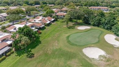 Experience luxury living in this stunning corner unit in Boca on Boca Lago Golf and Country Club in Florida - for sale on GolfHomes.com, golf home, golf lot