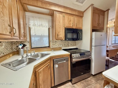 **Fully Furnished**Nestled on a large corner at the edge of on Augusta Ranch Golf Club in Arizona - for sale on GolfHomes.com, golf home, golf lot