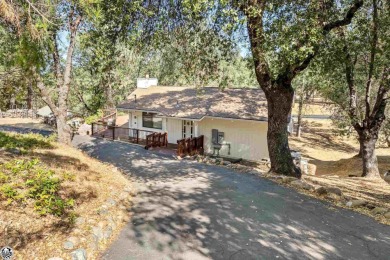 Relax and stay in this charming 3-bedroom, 2-bath cabin nestled on Pine Mountain Lake Country Club in California - for sale on GolfHomes.com, golf home, golf lot