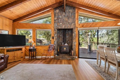 Relax and stay in this charming 3-bedroom, 2-bath cabin nestled on Pine Mountain Lake Country Club in California - for sale on GolfHomes.com, golf home, golf lot