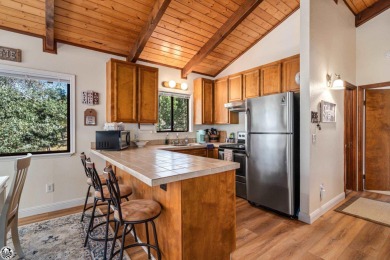 Relax and stay in this charming 3-bedroom, 2-bath cabin nestled on Pine Mountain Lake Country Club in California - for sale on GolfHomes.com, golf home, golf lot