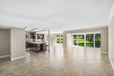 Serene lake views in this beautifully renovated 2-bedroom on Quail Ridge Golf Course and Country Club in Florida - for sale on GolfHomes.com, golf home, golf lot