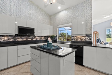 This elegant 3-bedroom, 2.5-bath home with an oversized 2.5-car on Waterford Golf Club in Florida - for sale on GolfHomes.com, golf home, golf lot