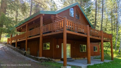 Escape to your own hand-hewn log retreat nestled in the woods of on Cedar Creek Golf Course in Wyoming - for sale on GolfHomes.com, golf home, golf lot