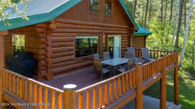 Escape to your own hand-hewn log retreat nestled in the woods of on Cedar Creek Golf Course in Wyoming - for sale on GolfHomes.com, golf home, golf lot