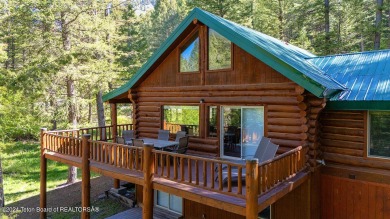 Escape to your own hand-hewn log retreat nestled in the woods of on Cedar Creek Golf Course in Wyoming - for sale on GolfHomes.com, golf home, golf lot