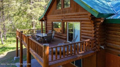 Escape to your own hand-hewn log retreat nestled in the woods of on Cedar Creek Golf Course in Wyoming - for sale on GolfHomes.com, golf home, golf lot