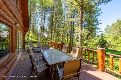 Escape to your own hand-hewn log retreat nestled in the woods of on Cedar Creek Golf Course in Wyoming - for sale on GolfHomes.com, golf home, golf lot