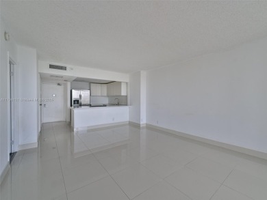 Step inside with me. Newly remodeled luxury condo in Aventura on Turnberry Isle Resort and Club in Florida - for sale on GolfHomes.com, golf home, golf lot