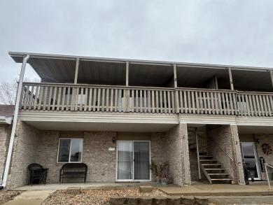 Discover the easy life in Okoboji with this inviting upper-level on Brooks National Golf Club in Iowa - for sale on GolfHomes.com, golf home, golf lot