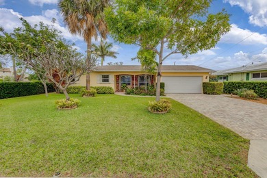 This immaculately maintained Midcentury home is nestled along on Lake Worth Municipal Golf Course in Florida - for sale on GolfHomes.com, golf home, golf lot