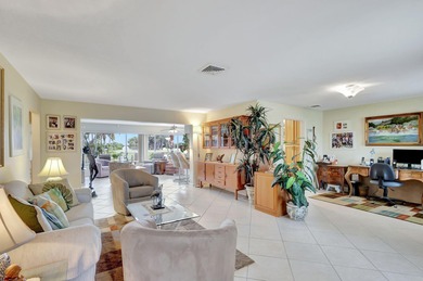 This immaculately maintained Midcentury home is nestled along on Lake Worth Municipal Golf Course in Florida - for sale on GolfHomes.com, golf home, golf lot