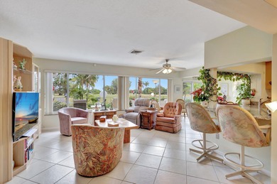 This immaculately maintained Midcentury home is nestled along on Lake Worth Municipal Golf Course in Florida - for sale on GolfHomes.com, golf home, golf lot