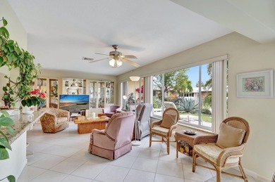 This immaculately maintained Midcentury home is nestled along on Lake Worth Municipal Golf Course in Florida - for sale on GolfHomes.com, golf home, golf lot