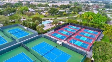 BRIGHT AND AIRY, EXTRA LARGE 1346 SQ/FT RENOVATED CORNER on Wynmoor Golf Course in Florida - for sale on GolfHomes.com, golf home, golf lot