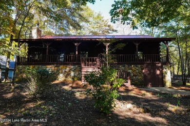 This 3 bedroom, 2 bath one level log home sits on a large flat on Stillwaters Golf and Country Club in Alabama - for sale on GolfHomes.com, golf home, golf lot