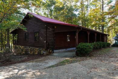 This 3 bedroom, 2 bath one level log home sits on a large flat on Stillwaters Golf and Country Club in Alabama - for sale on GolfHomes.com, golf home, golf lot