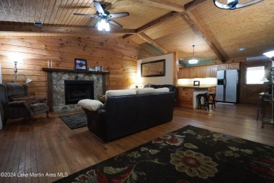 This 3 bedroom, 2 bath one level log home sits on a large flat on Stillwaters Golf and Country Club in Alabama - for sale on GolfHomes.com, golf home, golf lot