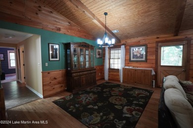 This 3 bedroom, 2 bath one level log home sits on a large flat on Stillwaters Golf and Country Club in Alabama - for sale on GolfHomes.com, golf home, golf lot