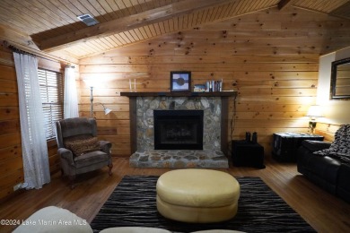 This 3 bedroom, 2 bath one level log home sits on a large flat on Stillwaters Golf and Country Club in Alabama - for sale on GolfHomes.com, golf home, golf lot