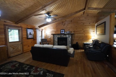 This 3 bedroom, 2 bath one level log home sits on a large flat on Stillwaters Golf and Country Club in Alabama - for sale on GolfHomes.com, golf home, golf lot