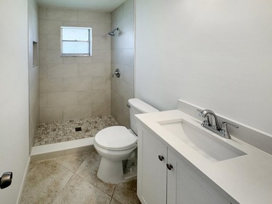 Welcome to 514 SW 20th Street in Palm Beach Leisureville on Leisureville Community Golf Course in Florida - for sale on GolfHomes.com, golf home, golf lot