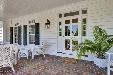 A timeless classic residence offering exceptional craftsmanship on Country Club of Landfall in North Carolina - for sale on GolfHomes.com, golf home, golf lot