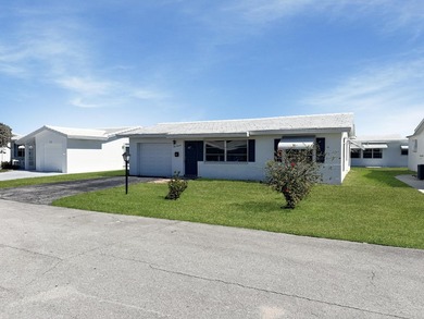 Welcome to 514 SW 20th Street in Palm Beach Leisureville on Leisureville Community Golf Course in Florida - for sale on GolfHomes.com, golf home, golf lot