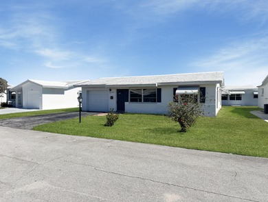 Welcome to 514 SW 20th Street in Palm Beach Leisureville on Leisureville Community Golf Course in Florida - for sale on GolfHomes.com, golf home, golf lot