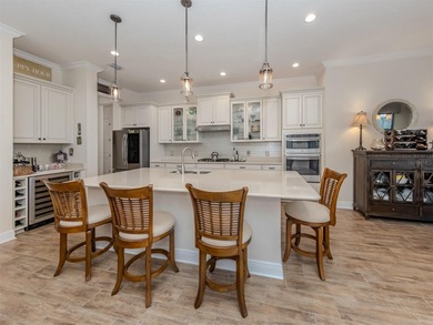 Discover relaxed lakefront living in this stunning home, where on Boca Royale Golf and Country Club in Florida - for sale on GolfHomes.com, golf home, golf lot