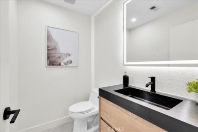 As you walk into this fully remodeled 2-bedroom, 2.5-bath home on  in California - for sale on GolfHomes.com, golf home, golf lot