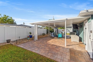 Welcome to an impeccable, move-in-ready corner lot Ranch home in on St. Petersburg Country Club in Florida - for sale on GolfHomes.com, golf home, golf lot