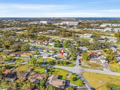 Welcome to an impeccable, move-in-ready corner lot Ranch home in on St. Petersburg Country Club in Florida - for sale on GolfHomes.com, golf home, golf lot