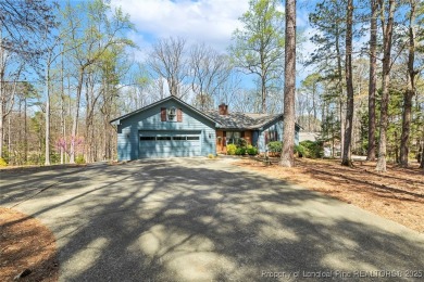 Say *Welcome Home* to this adorable English cottage-style home on Carolina Trace Country Club in North Carolina - for sale on GolfHomes.com, golf home, golf lot