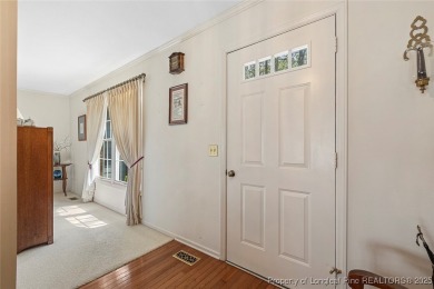 Say *Welcome Home* to this adorable English cottage-style home on Carolina Trace Country Club in North Carolina - for sale on GolfHomes.com, golf home, golf lot