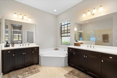 Situated in the desirable Country Club East of Lakewood Ranch on Ritz-Carlton Members Golf Club in Florida - for sale on GolfHomes.com, golf home, golf lot