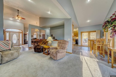 Beautiful custom home that overlooks the golf course & the city on Buffalo Golf Club in Wyoming - for sale on GolfHomes.com, golf home, golf lot