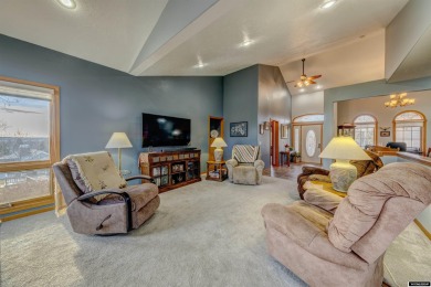 Beautiful custom home that overlooks the golf course & the city on Buffalo Golf Club in Wyoming - for sale on GolfHomes.com, golf home, golf lot