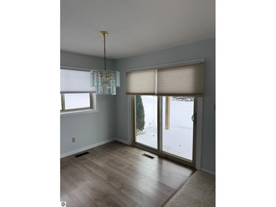 Green Meadows Condominiums ground-floor unit in a rare two-story on Bay Meadows Golf Course - Executive in Michigan - for sale on GolfHomes.com, golf home, golf lot