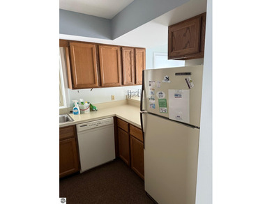 Green Meadows Condominiums ground-floor unit in a rare two-story on Bay Meadows Golf Course - Executive in Michigan - for sale on GolfHomes.com, golf home, golf lot