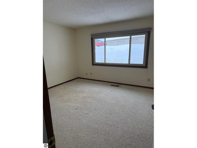 Green Meadows Condominiums ground-floor unit in a rare two-story on Bay Meadows Golf Course - Executive in Michigan - for sale on GolfHomes.com, golf home, golf lot