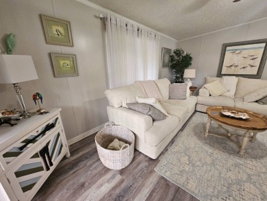 This immaculate 2-bedroom, 2-bath home has vinyl plank flooring on Big Cypress Golf and Country Club in Florida - for sale on GolfHomes.com, golf home, golf lot